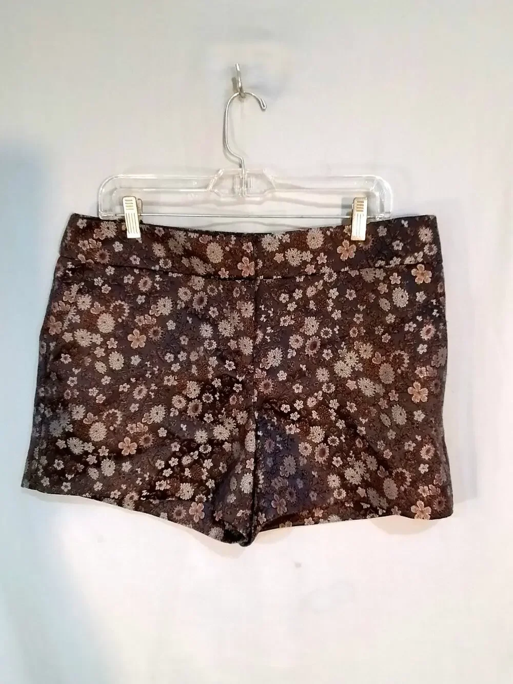 Gray tapestry shorts. Silver and rusty flowers on black background